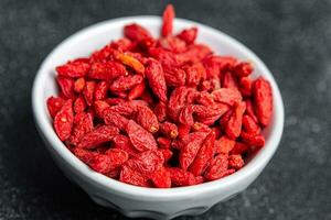 goji frutti di bosco delizioso cibo supplemento verdura cibo salutare pasto cibo merenda su il tavolo copia spazio cibo sfondo rustico superiore Visualizza foto