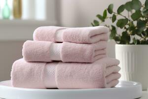 il del mondo più morbido asciugamani contro un' minimalista sfondo. impilati bianca asciugamani sedersi su superiore di un' sapone piatto nel un' bagno. ai generativo foto