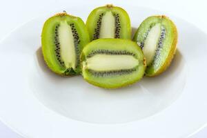 Kiwi frutta su bianca disco foto