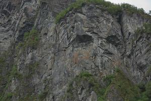 Troll faccia su una scogliera del Geirangerfjord, Norvegia foto