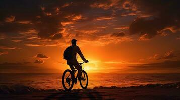 persona su un' bicicletta nel il tramonto. silhouette concetto foto