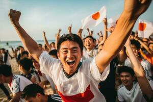 giapponese spiaggia calcio fan festeggiare un' vittoria foto