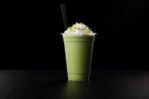 verde tè frappucino con frustato crema nel un' porta via tazza isolato su buio sfondo. ai generato foto