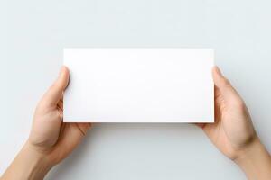 un' umano mano Tenere un' vuoto foglio di bianca carta o carta isolato su bianca sfondo. ai generato foto