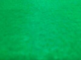 sfocato astratto tappeto sfondo nel luminosa verde colore foto