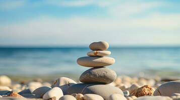 zen pietre su il mare spiaggia che rappresentano meditazione terme armonia e equilibrio con un' calmante sfondo di astratto mare bokeh su un' soleggiato giorno. silhouette concetto foto