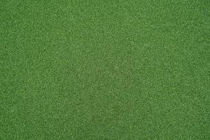 erba verde artificiale per lo sfondo. fondo di struttura del pavimento del tappeto erboso dell'erba verde.