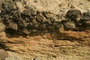 originale Marrone naturale sfondo di vulcanico congelato lava nel avvicinamento foto