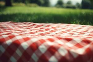 rosso e bianca plaid picnic coperta su superiore di un' verde campo nel soleggiato giorno su erba di prato nel estate parco. sfocato sfondo. generativo ai foto