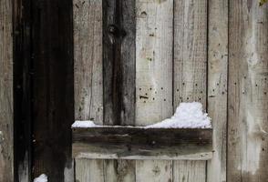 fondo in legno con neve foto