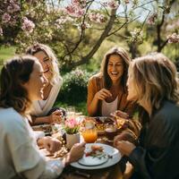 amici condivisione risata e pasti sotto il baldacchino di fioritura alberi nel un' primavera giardino ai generativo foto