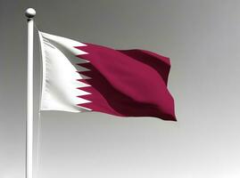 Qatar nazionale bandiera agitando su grigio sfondo foto