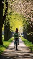 spensierato donna gode un' bicicletta cavalcata attraverso un' lussureggiante verde parco Abbracciare una persona primavera vitalità ai generativo foto