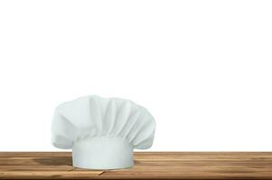 di legno tavolo con vuoto spazio e cucina cappello isolato su bianca sfondo. foto