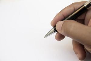 la mano dell'uomo d'affari che scrive qualcosa sullo spazio white paper.copy. foto