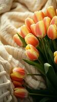 fresco tulipani e un' a maglia maglione disposte nel un' di moda piatto posare verticale mobile sfondo ai generato foto