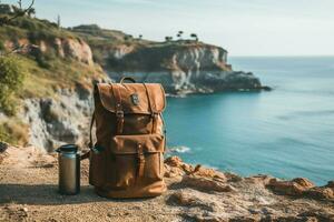 esplorazione concetto zaino, caffè thermos contro un' costiero sfondo, simboleggiante avventure ai generato foto