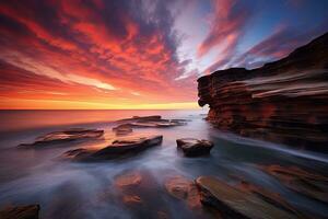 bellissimo paesaggio marino a tramonto. composizione di natura. australiano paesaggio marino a Alba con ricco nel rosso colore nube formazione, ai generato foto