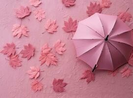 rosa sfondo con autunno le foglie e ombrello foto