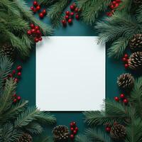 bianca carta su Natale sfondo coperto di abete rami con rosso foto