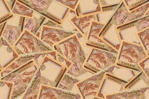 10 nepalese rupie fatture bugie nel grande mucchio. ricco vita concettuale sfondo foto