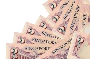 2 singaporean dollari fatture bugie nel diverso ordine isolato su bianca. Locale bancario o i soldi fabbricazione concetto foto