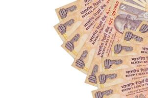 10 indiano rupie fatture bugie isolato su bianca sfondo con copia spazio. ricco vita concettuale sfondo foto