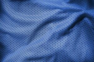 vicino su di poliestere nylon abbigliamento sportivo pantaloncini per creato un' strutturato sfondo. fantasma classico blu colore foto