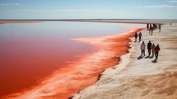 turisti a piedi su deserto sabbia dune con rosso fiume aereo Visualizza a tramonto, generato con ai foto