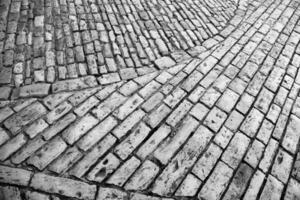 vecchio muro di mattoni strutturato di pietre eleganti per la decorazione domestica foto