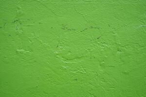 astratto leggero verde stucco sfondo. parete edificio vicino su. ruvido superficie gesso struttura con copia spazio per design foto