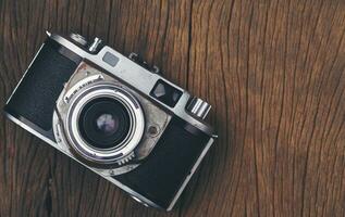 Vintage ▾ vecchio film telecamera su legna tavola foto