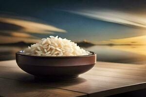 un' ciotola di riso su un' tavolo con un' tramonto nel il sfondo. ai-generato foto