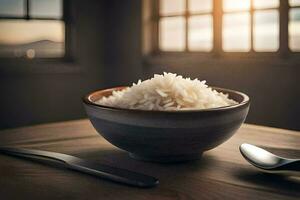 un' ciotola di riso su un' tavolo con un' cucchiaio e un' coltello. ai-generato foto