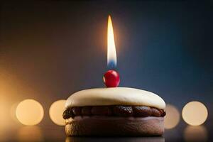 un' singolo candela è illuminato su un' cioccolato torta. ai-generato foto