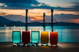 quattro bicchieri di succo su un' tavolo nel davanti di un' lago. ai-generato foto