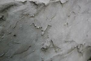 irregolare cemento e sabbia parete struttura sfondo, grungy cemento parete superficie, rustico sabbia parete foto