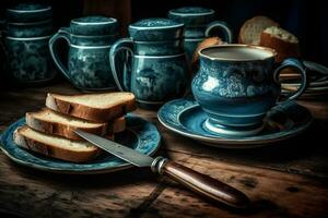 tavolo con blu porcellana tazze e teiera e fette di pane e torta per prima colazione. ai generato foto