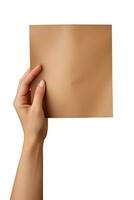 un' umano mano Tenere un' vuoto foglio di Marrone carta o carta isolato su un' bianca sfondo. ai generato foto