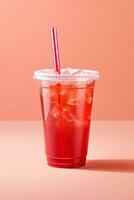 rosso bevanda nel un' plastica tazza isolato su un' rosso pastello sfondo. prendere lontano bevande concetto. ai generato foto