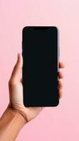 mano Tenere smartphone con un' nero vuoto schermo isolato su un' rosa sfondo. ai generato foto