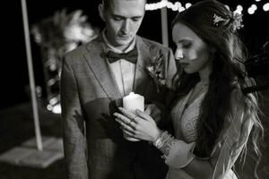 trasferimento di nozze fuoco con il Aiuto di candele il Novelli sposi foto
