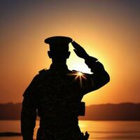 silhouette di un' soldato salutando durante tramonto ai generato foto