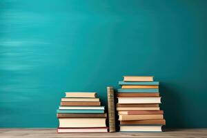 mucchio di libri nel davanti di un' blu parete con copia spazio, libri su di legno tavolo con alzavola sfondo per indietro per scuola, ai generato foto