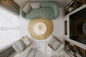 superiore Visualizza di scandinavo stile vivente camera dove bianca e verde trascinare divano, bianca di legno poltrona, rustico stile tappeto sotto il caffè tavolo 3d interpretazione foto