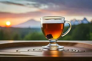 un' bicchiere di tè si siede su un' di legno vassoio con un' montagna nel il sfondo. ai-generato foto
