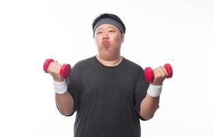 giovane asiatico divertente sport uomo grasso esercizio con dumbbell foto