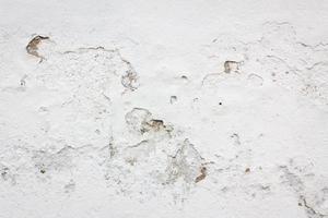 frammento di pietra muro bianco