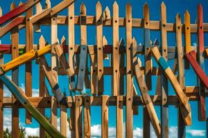 un' recinto fatto di di legno bastoni con molti diverso colorato pezzi. ai-generato foto