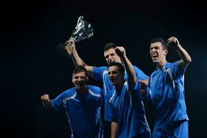 calciatori che celebrano la vittoria foto